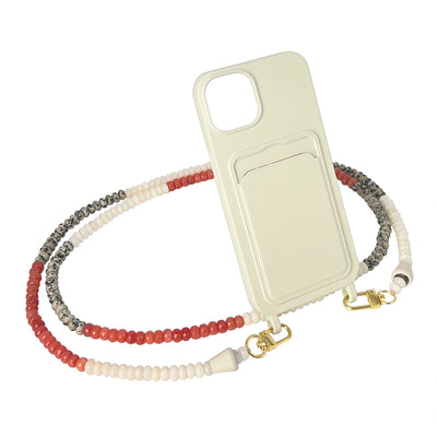 Red, white, and leopard-print gemstones with clasps and matching blush white phone case.