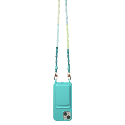 Perfect summer beach accessory: turquoise phone case with a card holder and eyelets for a detachable matching ocean blue gemstone necklace phone chain.