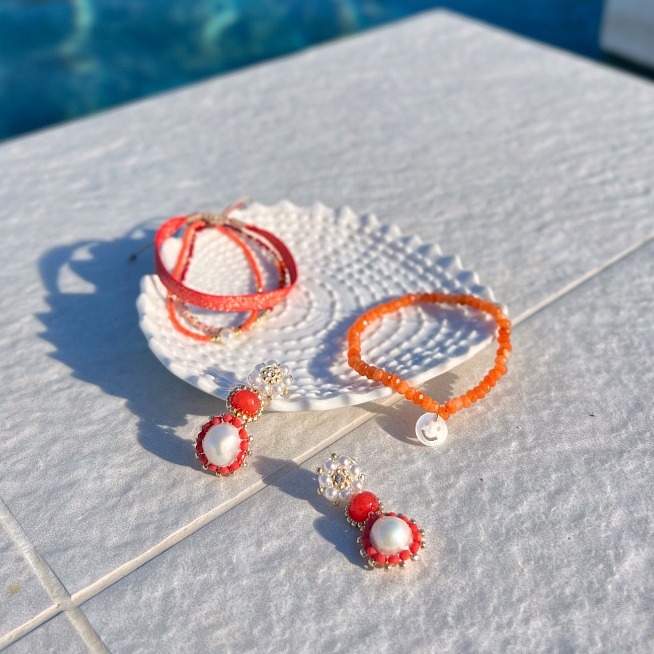 orange and coral summer jewelry made from freshwater pearls and natural gemstones