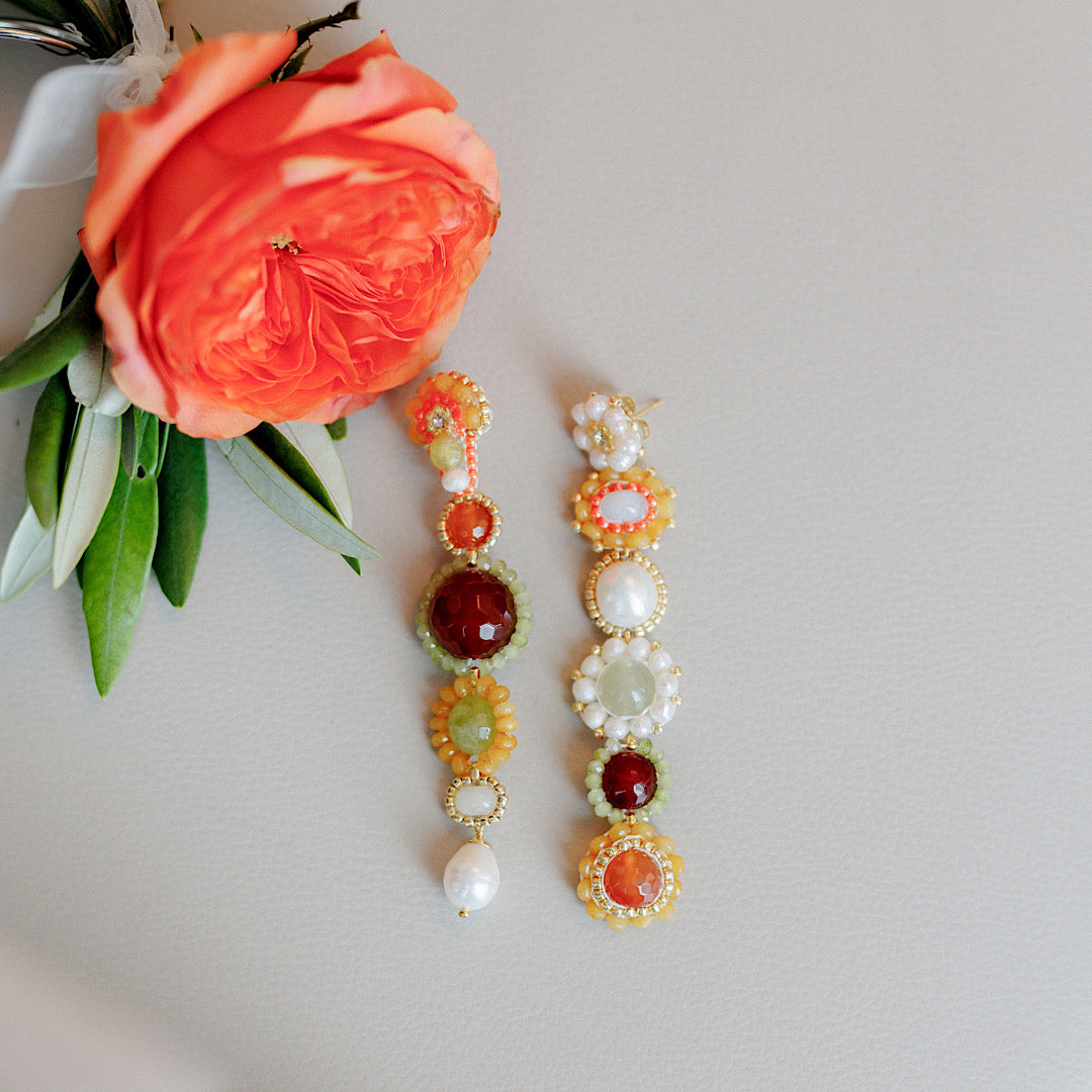 asymmetrical bridesmaid earrings in hanging statement design made from green, red and white natural gemstones