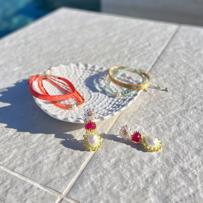 colourful summer jewelry in orange, red, pink and yellow