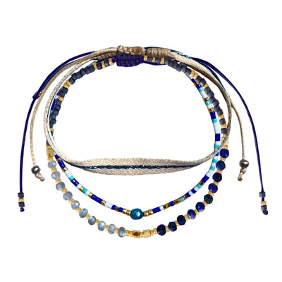 dark blue bracelet set with three glitter and pearl bracelets