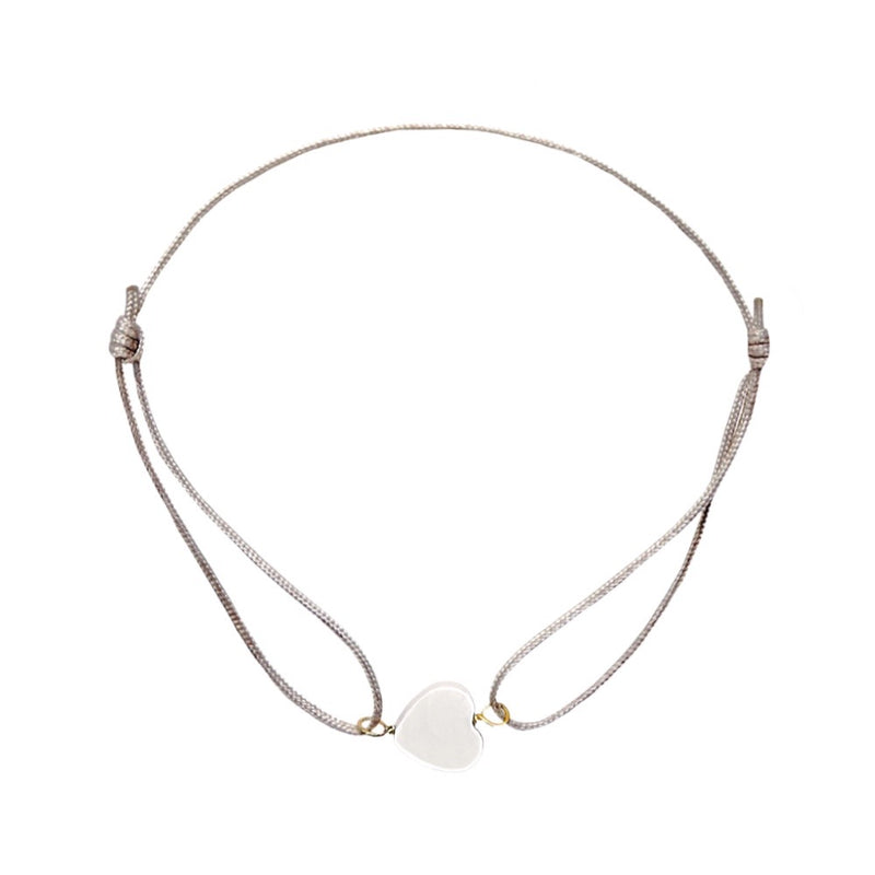 Little heart beacelet with adjustable strap made from thin nylon ribbon. - Gratisgeschenk