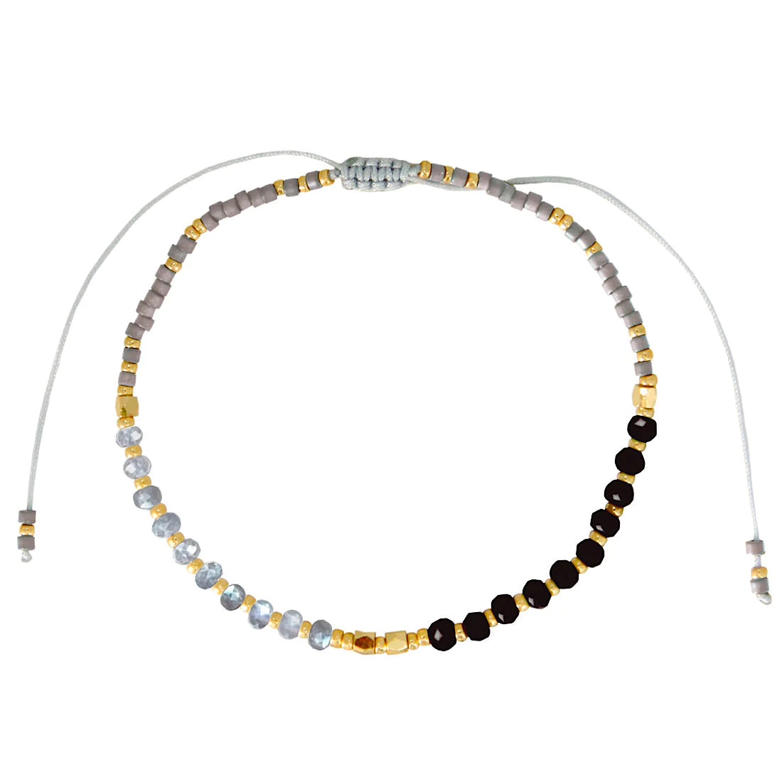 One bead strand of a three strand black-and-white beige bracelet set.