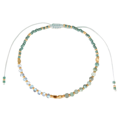 One bead strand of a mint green 3-strand bracelet set.
