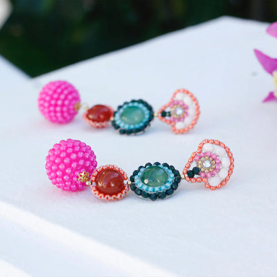 Colourful boho style bohemian earrings in a tropical setting.