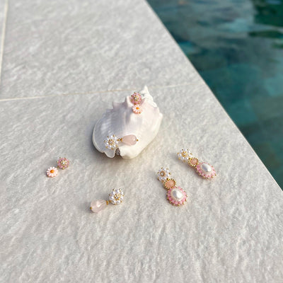 light pink statement earrings with gold details and freshwater pearls