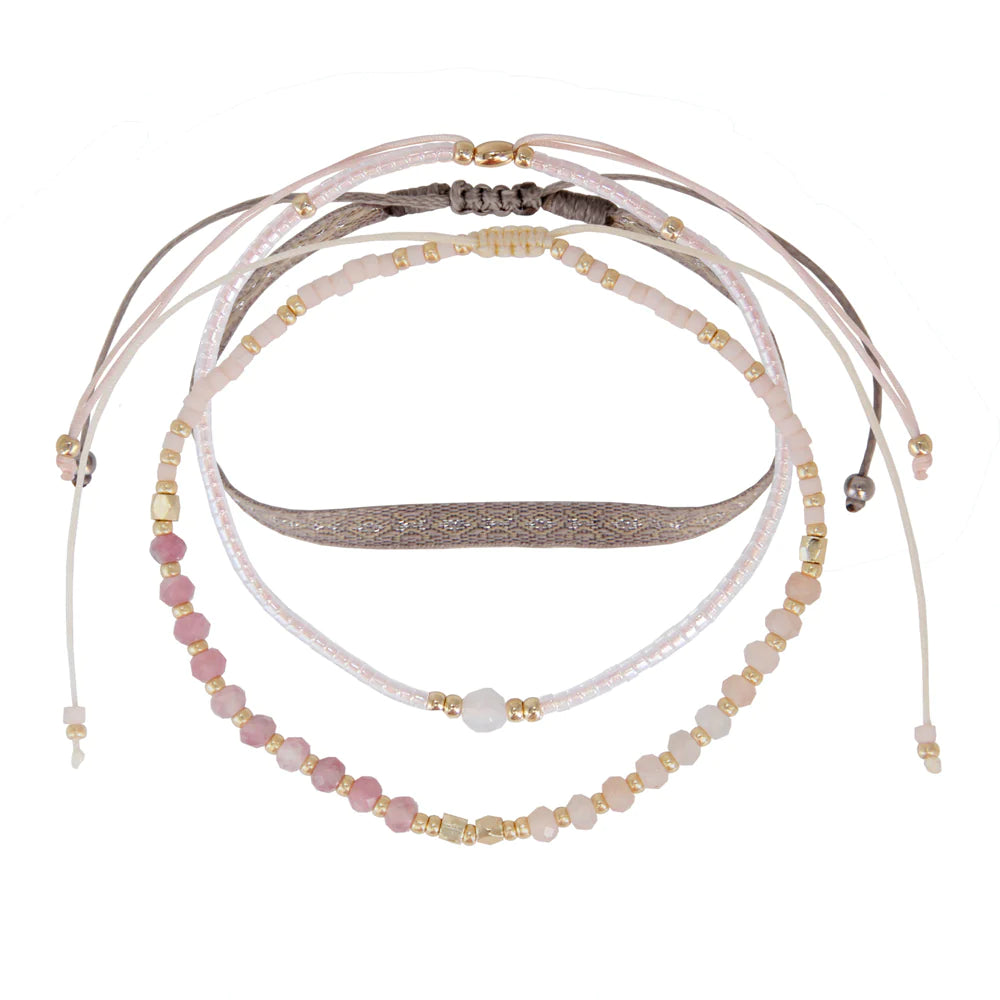 A light pink rose quartz three strand bracelet set.