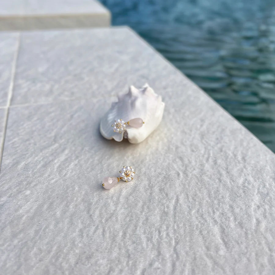 Perfect beach day: pink rosequartz earrings displayed by a beach shell.