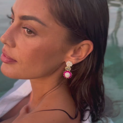 woman wearing summer statement earrings with pink swarovski stones and natural gemstone