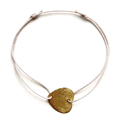 champagne coloured nylon thread bracelet with gold plated heart pendant