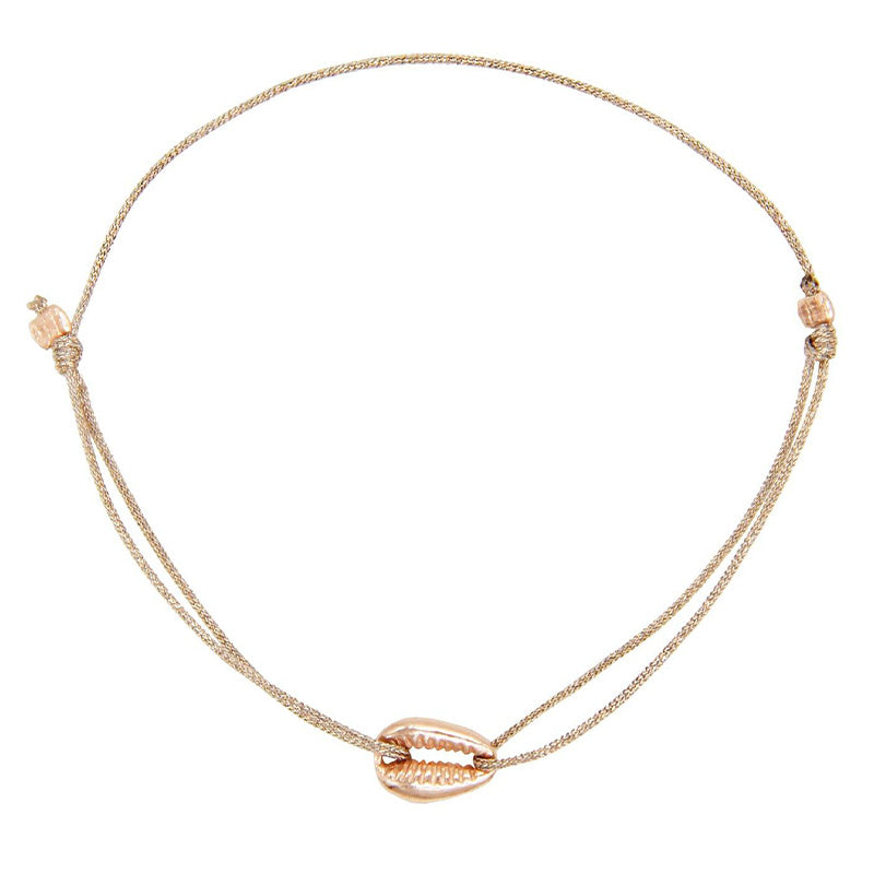 glittery beige nylon thread bracelet with rosegold cowrie shell