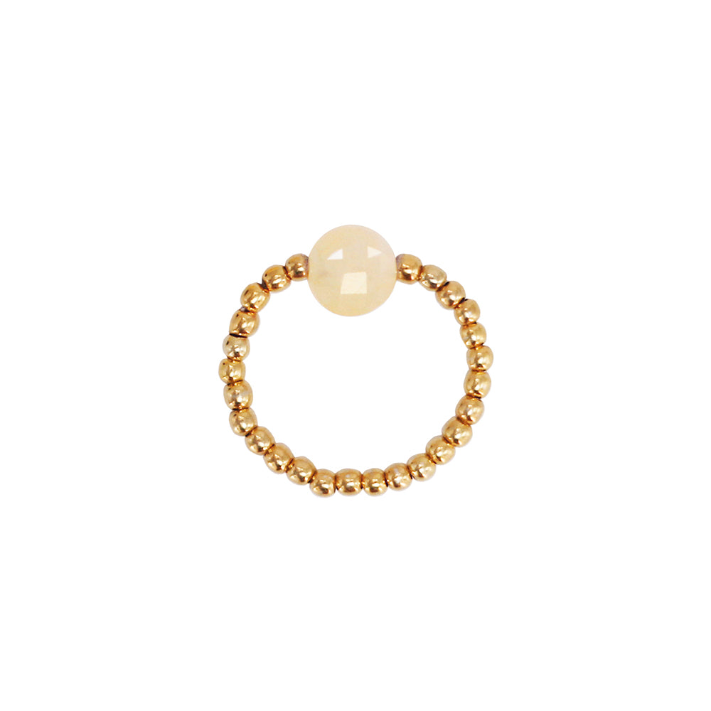stretch ring with small 18k gold plated beads and a light beige gemstone