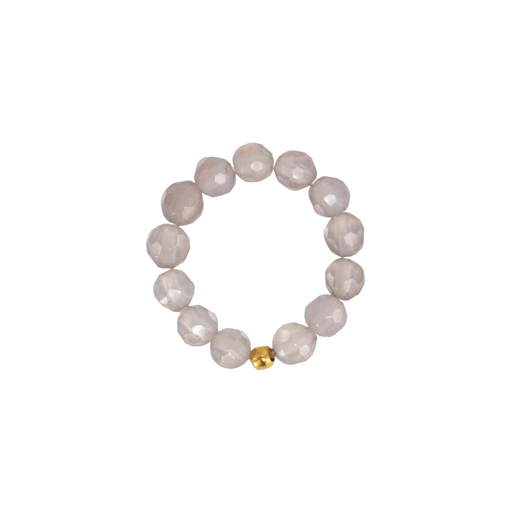 stretch ring out of grey quartz stones and one 18k gold plated pearl