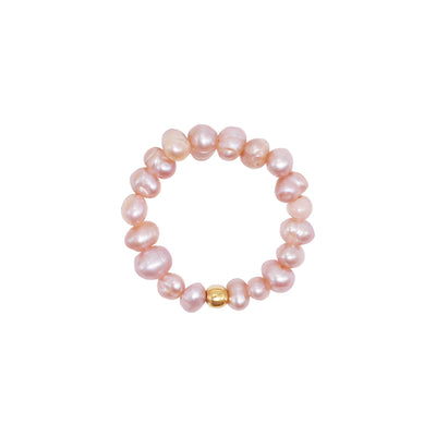 stretch ring out of small lilac and pink freshwater pearls and a 18 karat gold plated pearl 