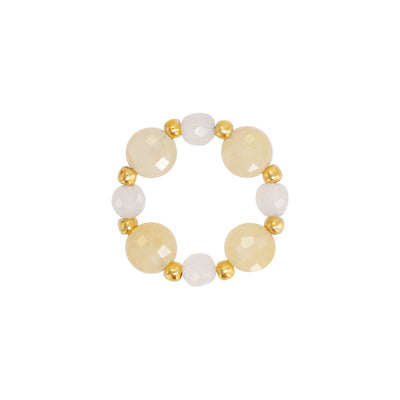 tretch ring with light beige and white gemstones and 18 karat gold plated beads