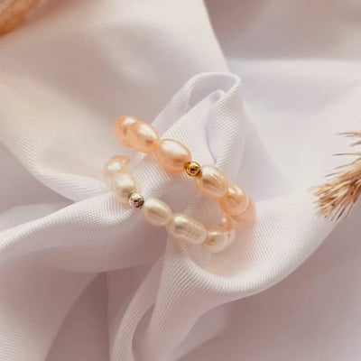 ring made out of rose coloured freshwater pearls and one gold plated bead