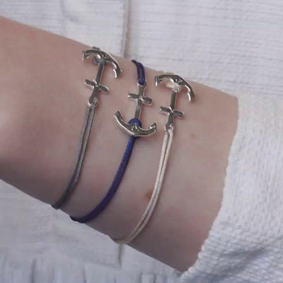 beige nylon thread bracelet with silver anchor pendant