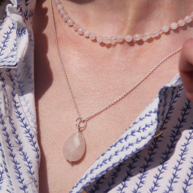silver necklace with tear shaped rose quartz pendant