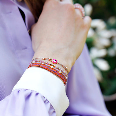 glittery beige nylon bracelet with pink nazar eye pendant
