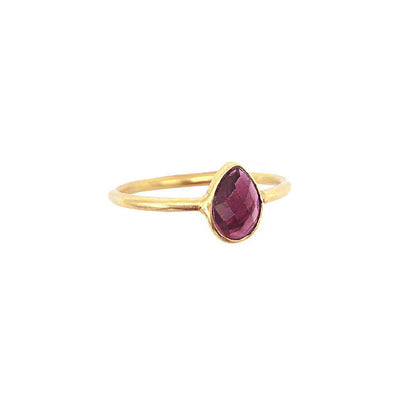 gold plated ring with purple teardrop shaped garnet gemstone 
