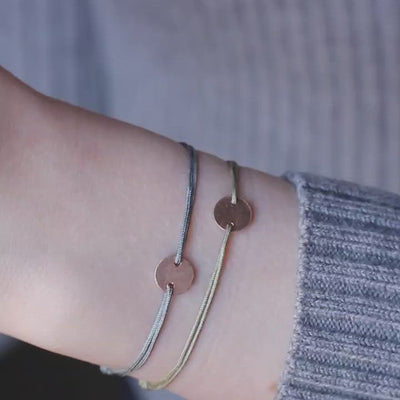 green nylon thread bracelet with round rosegold pendant