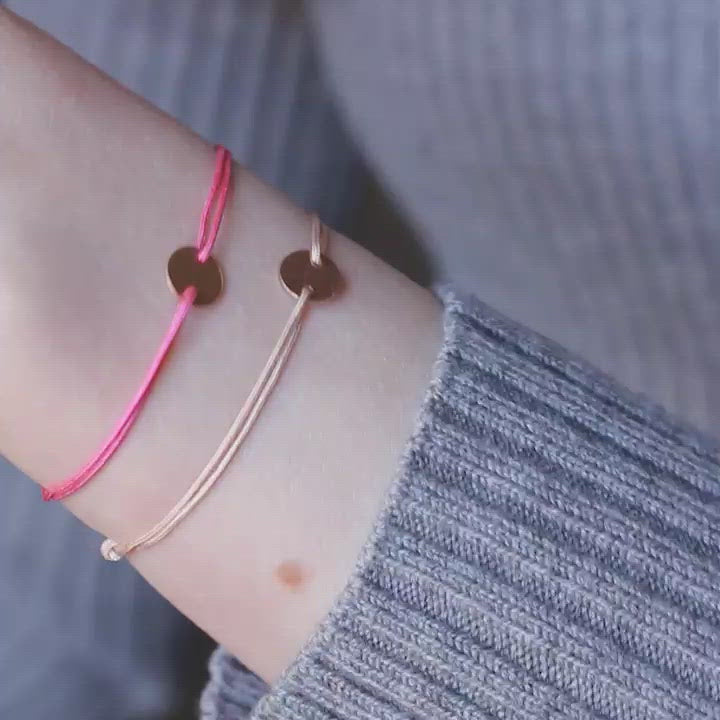 pink nylon thread bracelet with round rosegold pendant