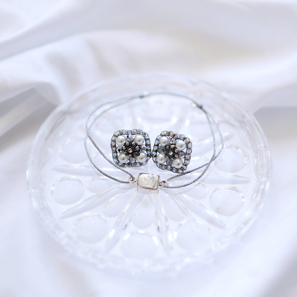 square earstuds with white artificial pearls and grey and silver beads
