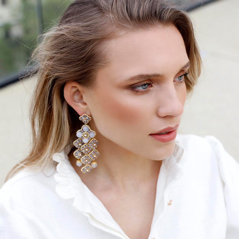 big golden statement earrings with taupe colored agate stones and beige quartz stones