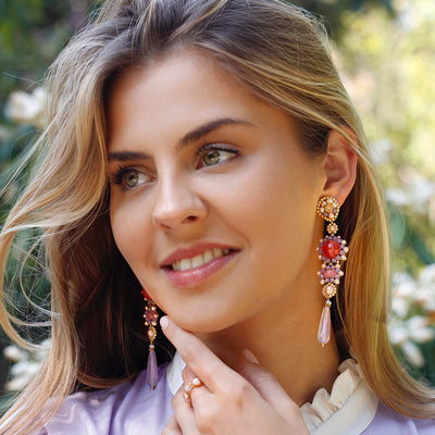 lilac colored statement earrings with round peach colored quartz stone and gold details