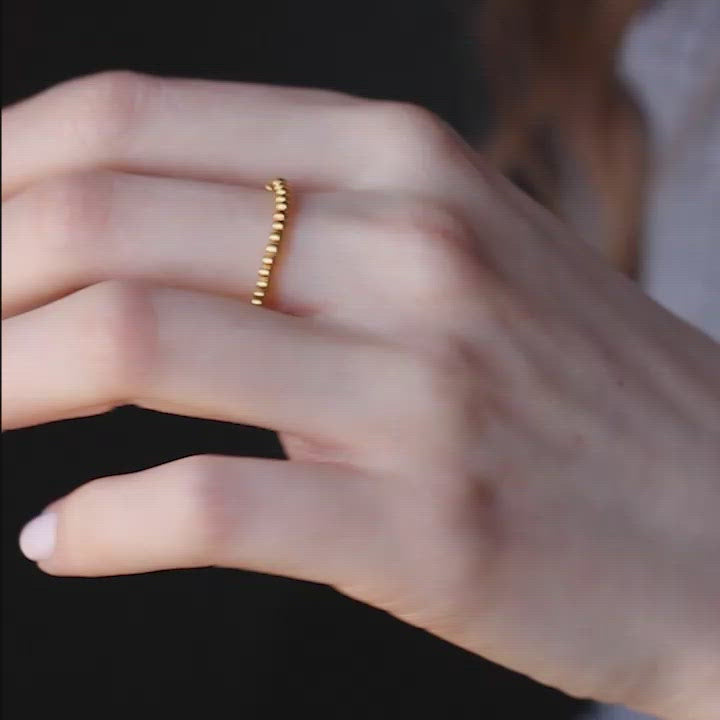 fine ring made out of gold plated beads