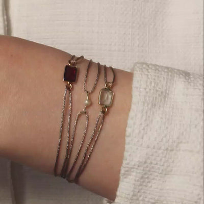 glittery bronze nylon thread bracelet with square red garnet gemstone