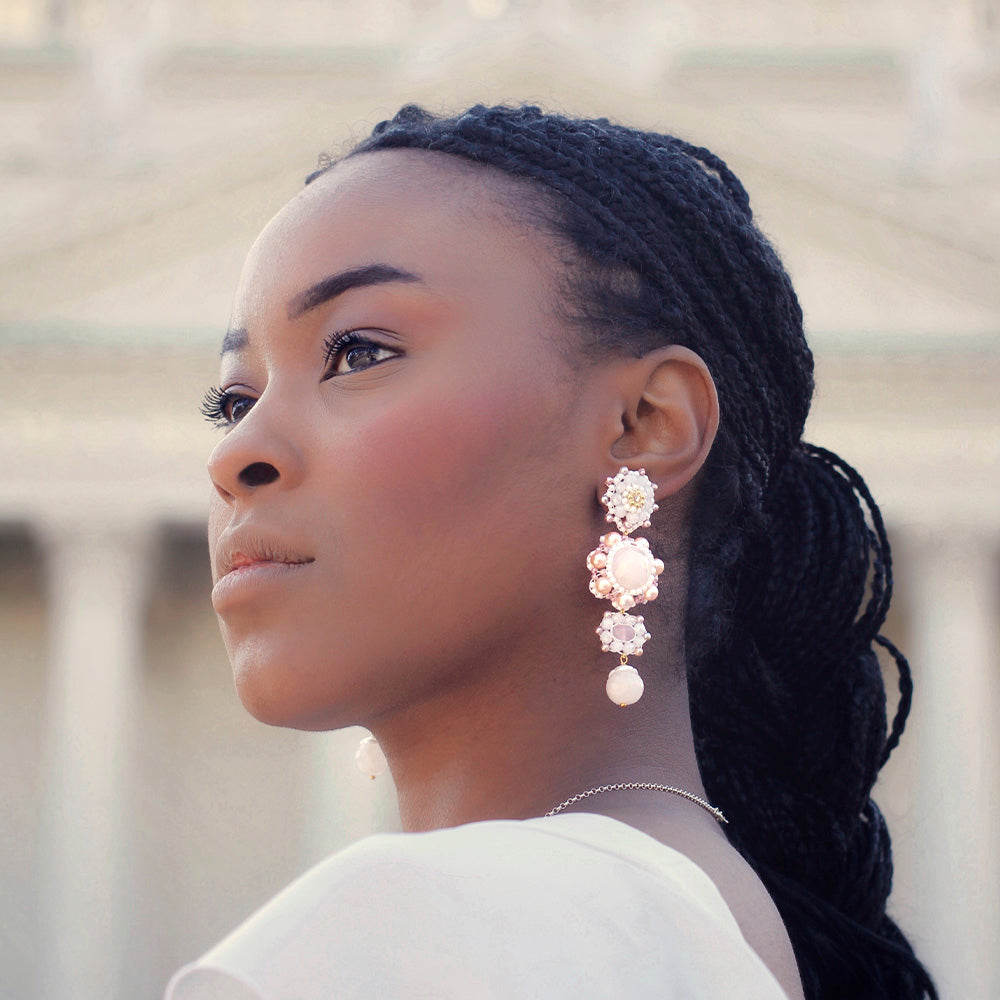 pink and white flower shaped statement earrings with pearls for weddings