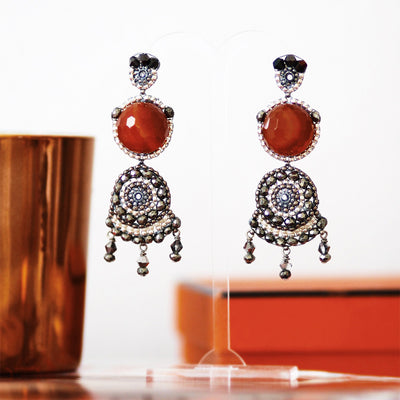 big silver statement earrings with round red carnelian stone and dark grey beads