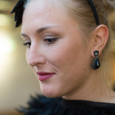 black drop-shaped earrings with black oval onyx stones and small beads