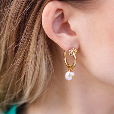 small gold plated hoops with rose colored freshwater pearls 
