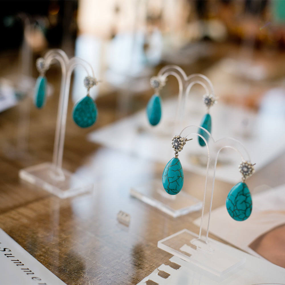 small silver earrings with turquoise howlite stone drop