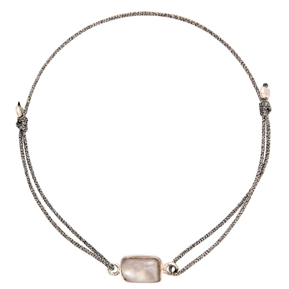 glittery silver nylon thread bracelet with square cream coloured freshwater pearl