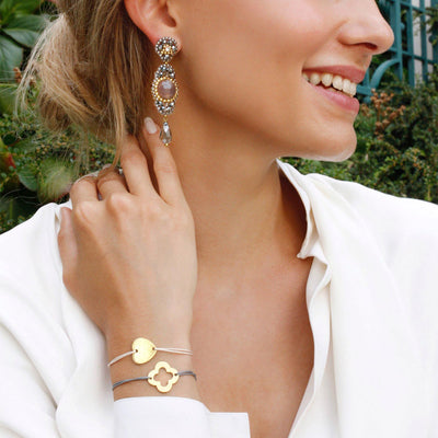 grey statement earrings with golden nylon thread bracelets jewellery set