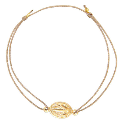 glittery beige nylon thread bracelet with gold plated talisman