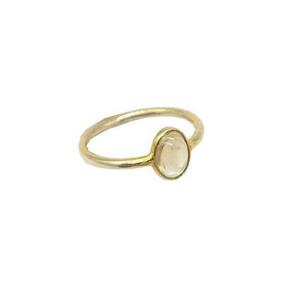 gold plated ring with beige oval shaped citrine gemstone