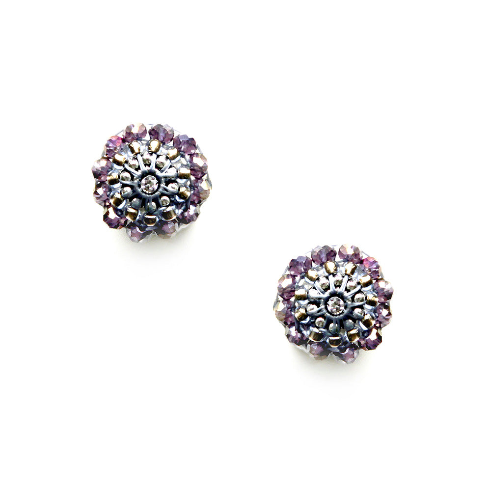 round silver earstuds made out of light purple glass beads