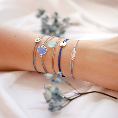 grey nylon thread bracelet with round blue quartz gemstone