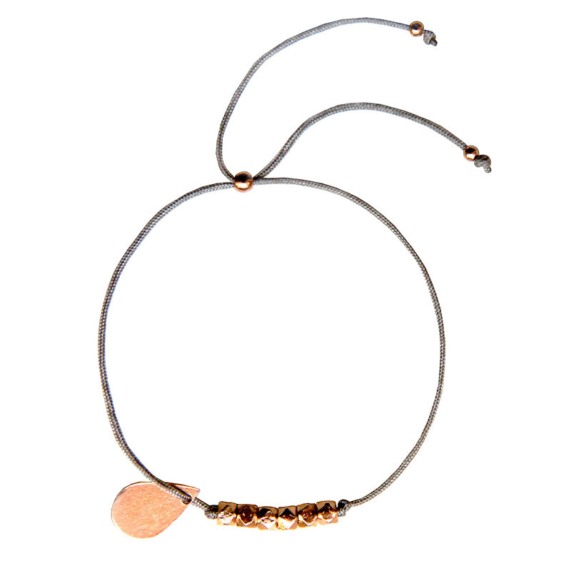 beige nylon thread bracelet with rosegold teardrop pendant