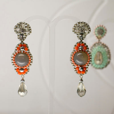long silver statement earrings with round grey gemstone and small orange beads