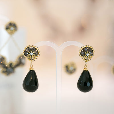 small black earrings with tear shaped black onyx stone and small golden beads