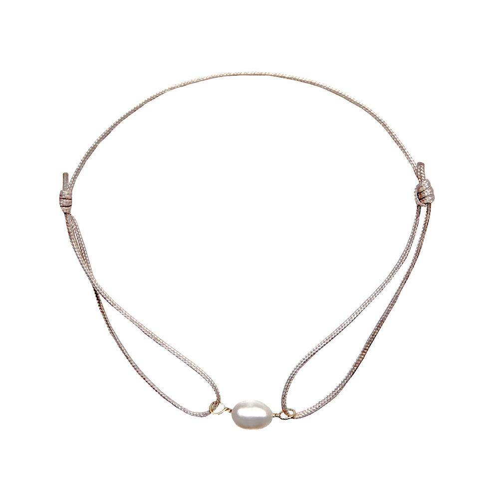 champagne colored nylon thread bracelet with small white freshwater pearl