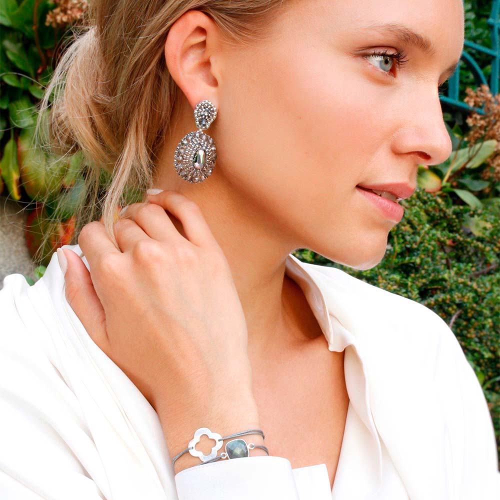 drop-shaped silver earrings and grey bracelets jewellery set