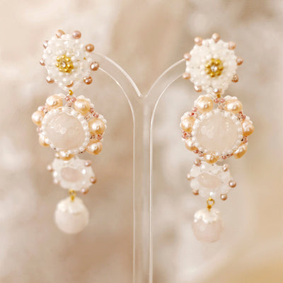 pink and white flower shaped statement earrings with pearls for weddings