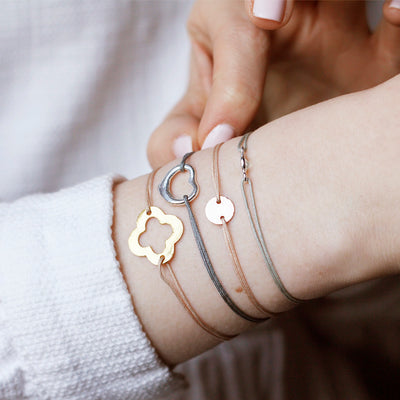 grey nylon thread bracelet with heart shaped silver pendant